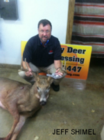 Man holding killed buck