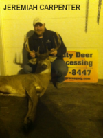 Man holding killed buck