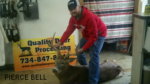 Man holding killed buck