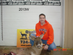 Man holding killed buck