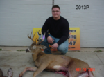 Man holding killed buck