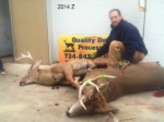 Man holding killed buck