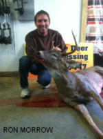 Man holding killed buck