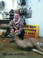 Man holding killed buck