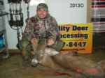 Man holding killed buck