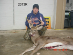 Man holding killed buck