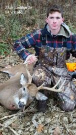 Man holding killed buck