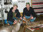 Man holding killed buck
