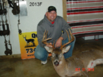 Man holding killed buck