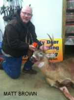 Man holding killed buck