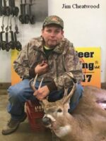 Man holding killed buck