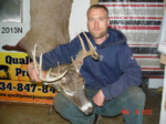 Man holding killed buck