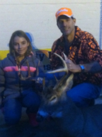 Man holding killed buck