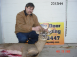 Man holding killed buck