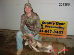 Man holding killed buck