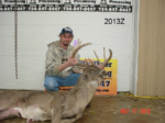 Man holding killed buck