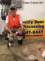 Man holding killed buck