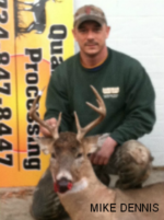 Man holding killed buck