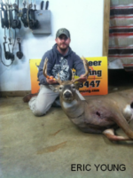 Man holding killed buck
