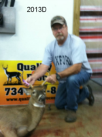 Man holding killed buck