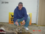 Man holding killed buck
