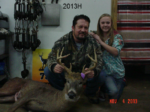 Man holding killed buck