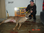 Man holding killed buck