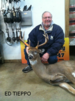 Man holding killed buck