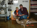 Man and boy holding killed buck