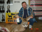 Man holding killed buck