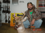 Man holding killed buck