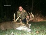 Man holding killed buck