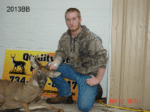 Man holding killed buck