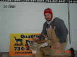 Man holding killed buck