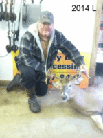 Man holding killed buck