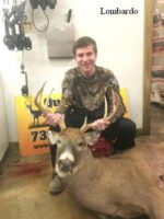 Man holding killed buck