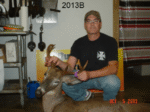 Man holding killed buck