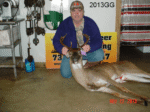 Man holding killed buck
