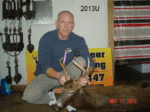 Man holding killed buck